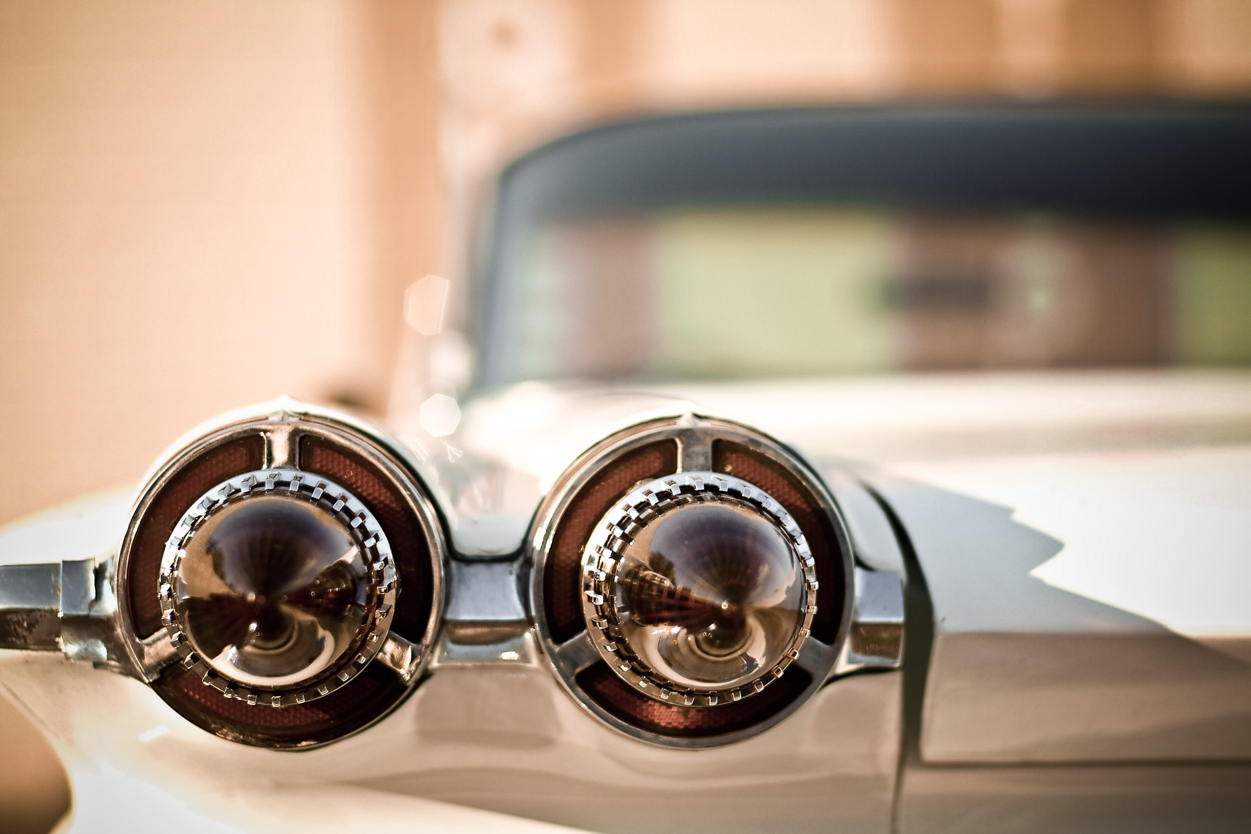A vintage automobile sports its futuristic rear headlamps in Austin