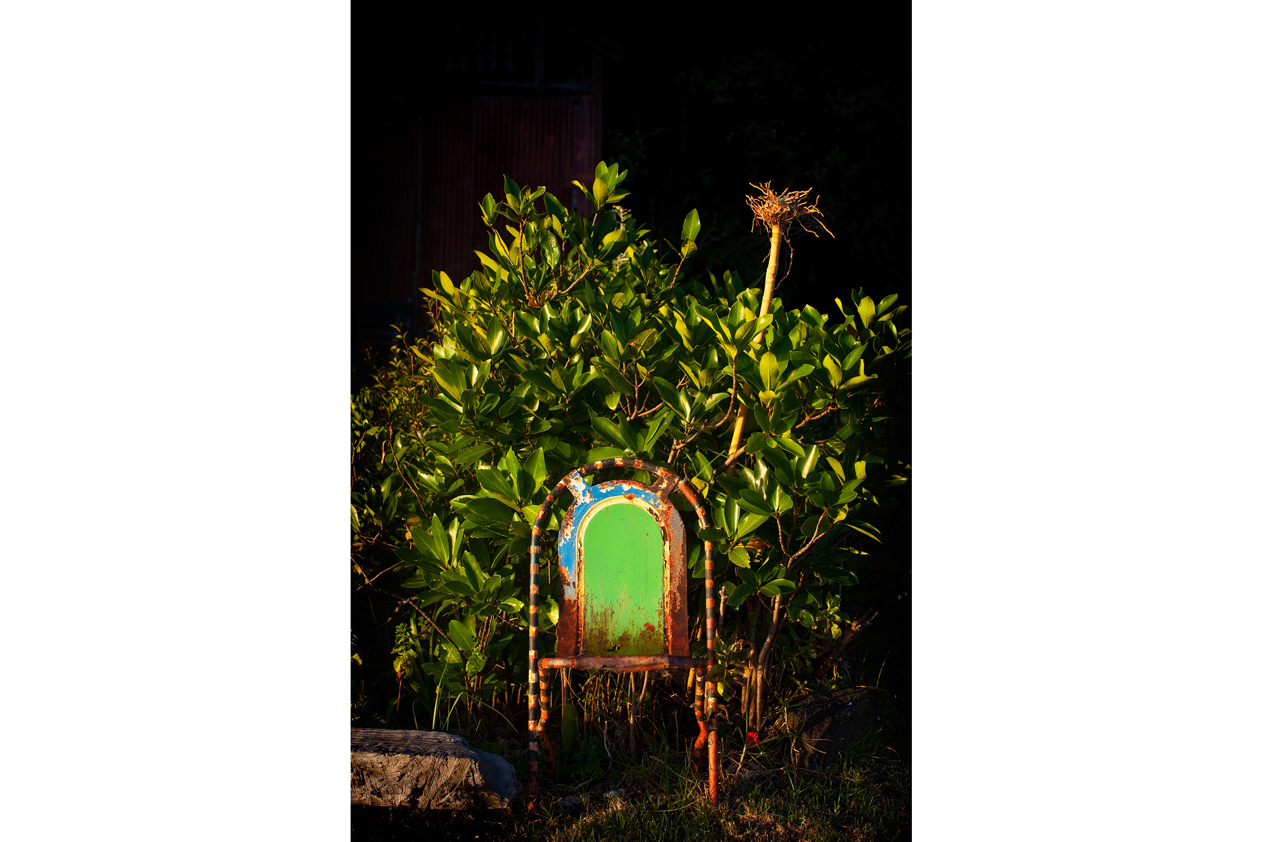 A rusted chair waits for its sitter